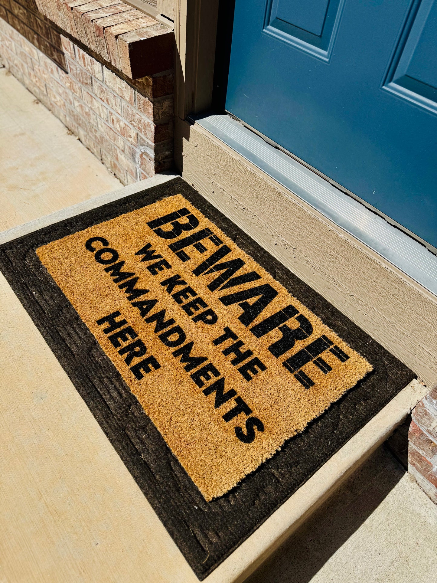 BEWARE | WE KEEP THE COMMANDMENTS HERE 18x30 Doormat
