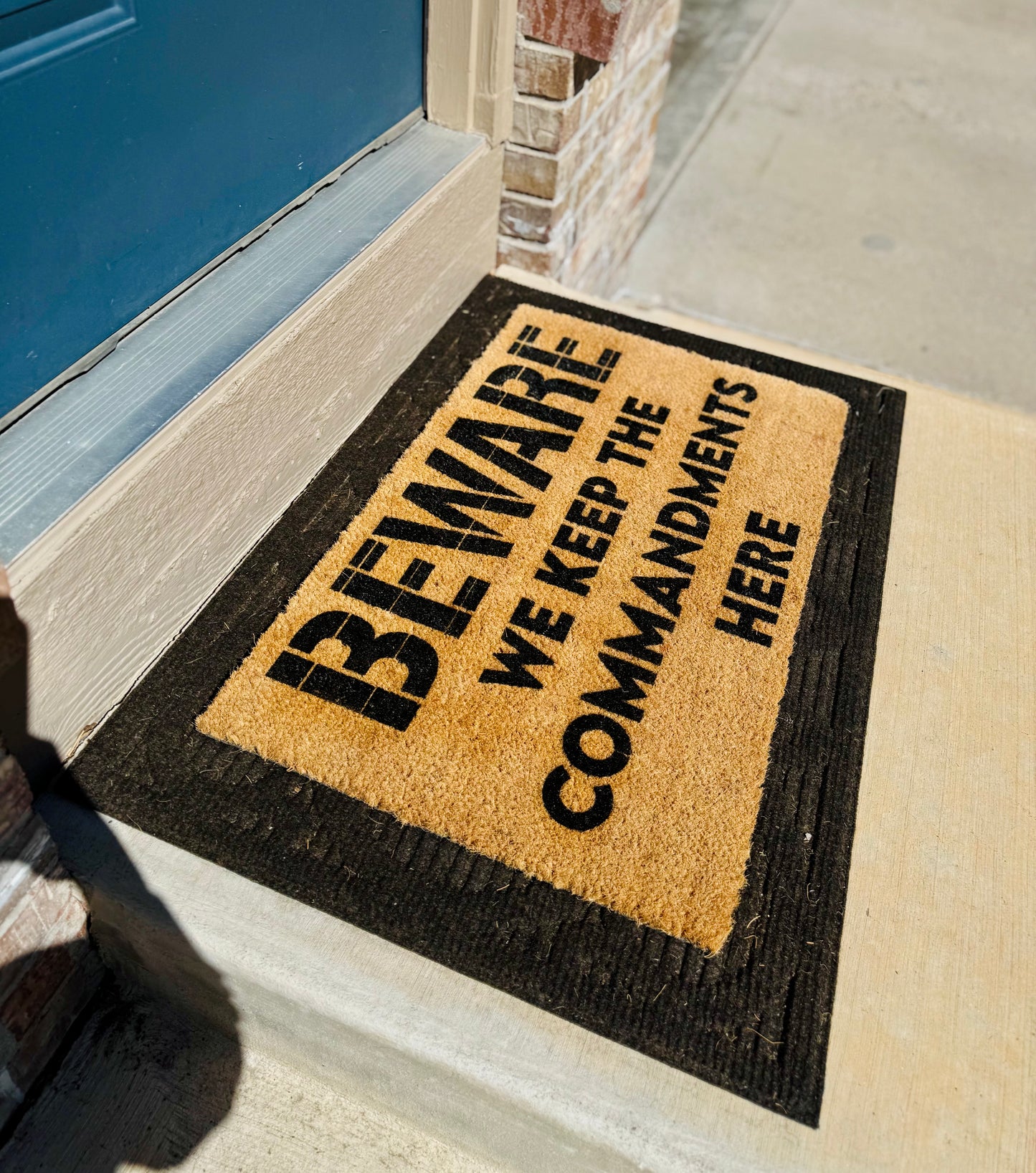 BEWARE | WE KEEP THE COMMANDMENTS HERE 18x30 Doormat